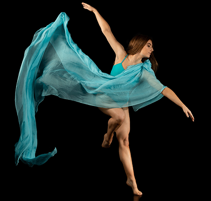 Woman in a blue dress dancing